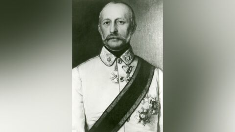 schwarz-weiß Porträt eines Mannes in Uniform mit Schnauzbart